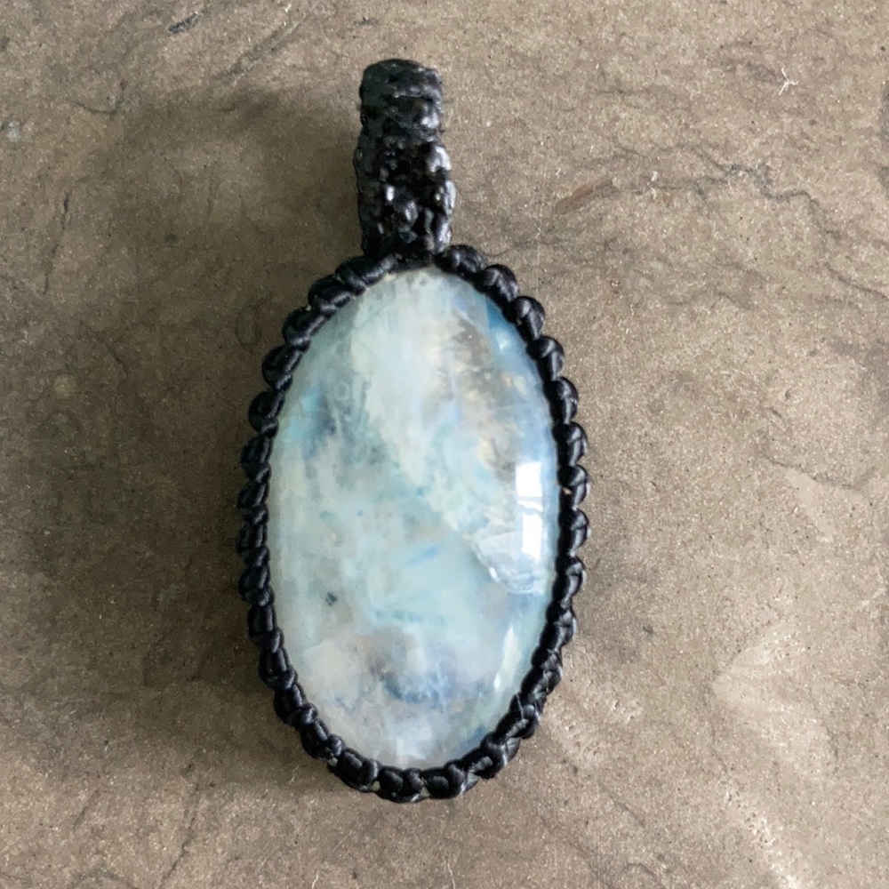 Beautiful moonstone pendant with macrame wrapping